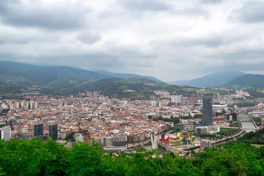 aerial-view-of-bilbao-city-and-guggenheim-museum-30614903 Aerial view of Bilbao, Spain featuring the Guggenheim Museum and surrounding urban landscape.